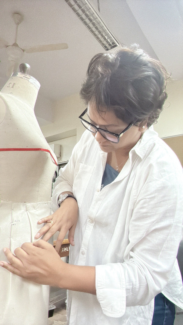 Founder of White Co India working on handcrafted garment design in natural fabrics